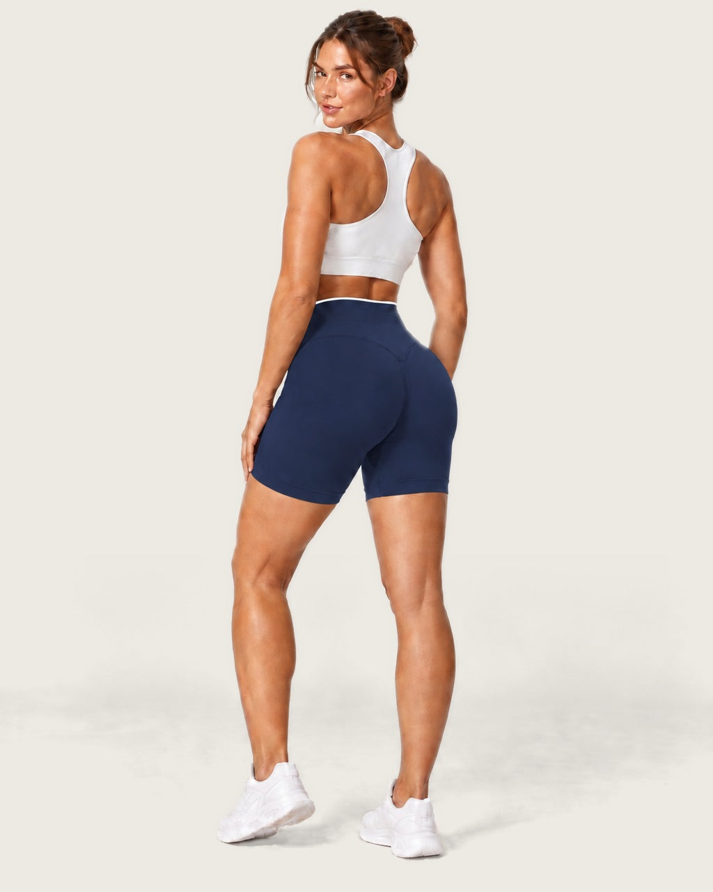 ROMY Form Contrast Waist Shorts in Navy — three-quarter back view