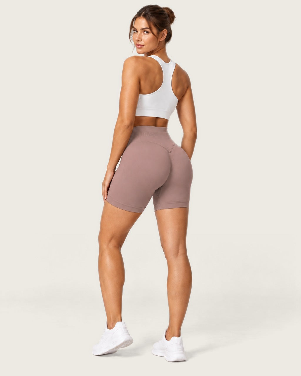 ROMY Form Seamless Shorts in Dusty Rose — three-quarter back view