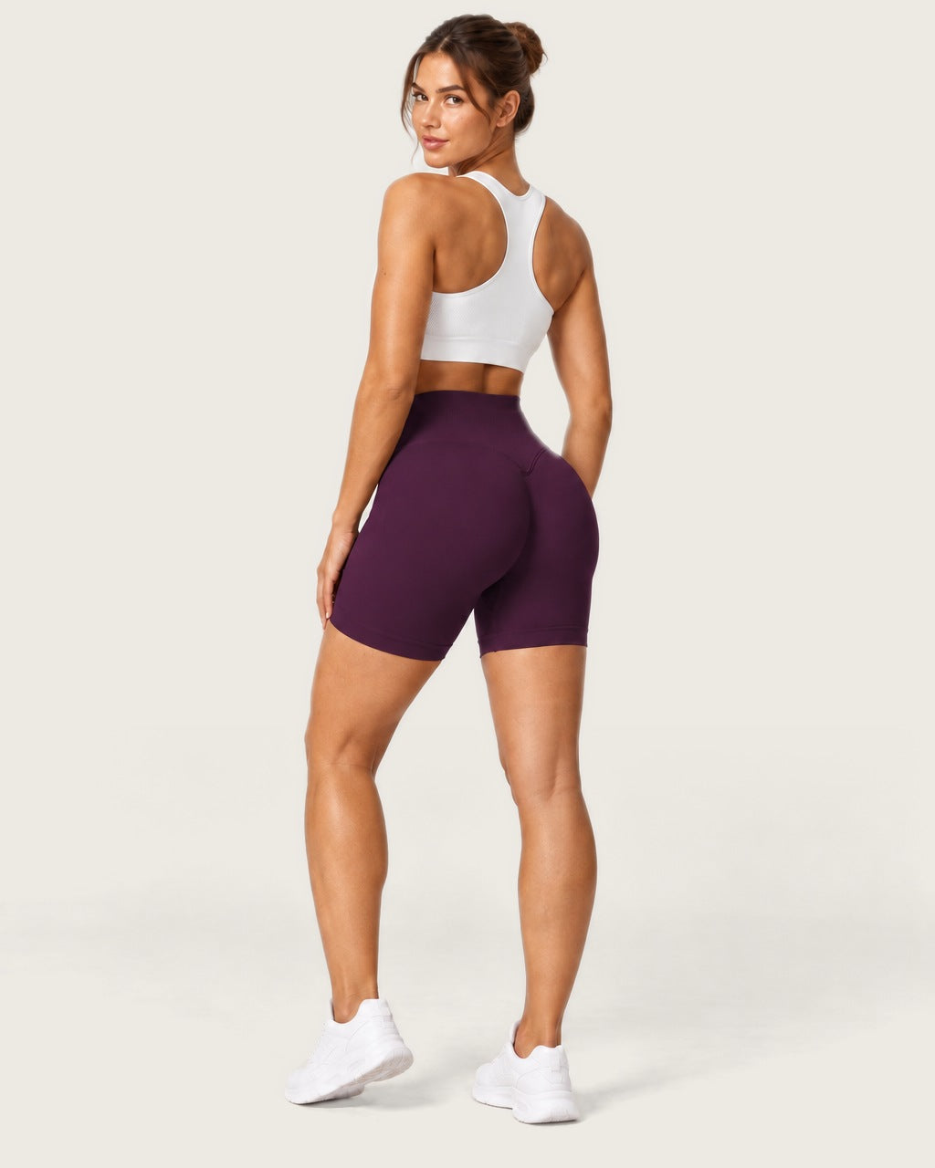ROMY Form Seamless Shorts in Plum — three-quarter back view