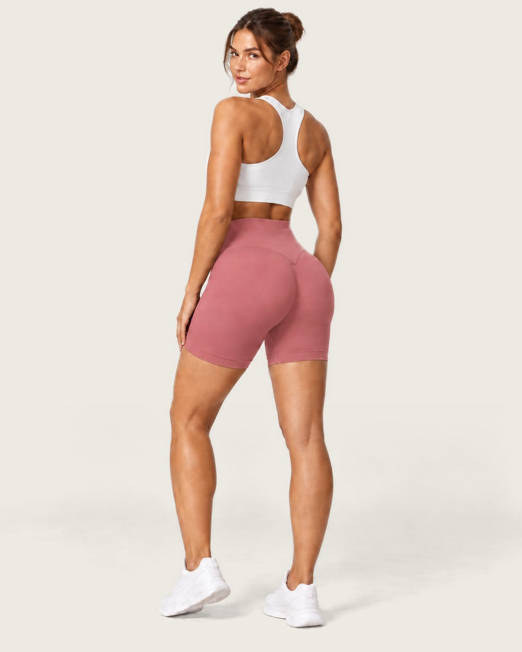 ROMY Form Seamless Shorts in Rosewood — three-quarter back view