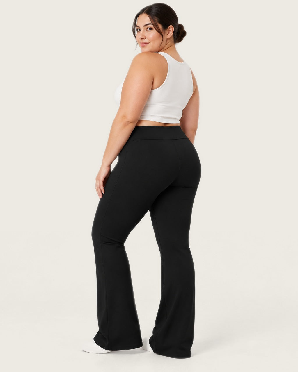 ROMY Sculpt Plus Flare Pant in Black — three-quarter back view