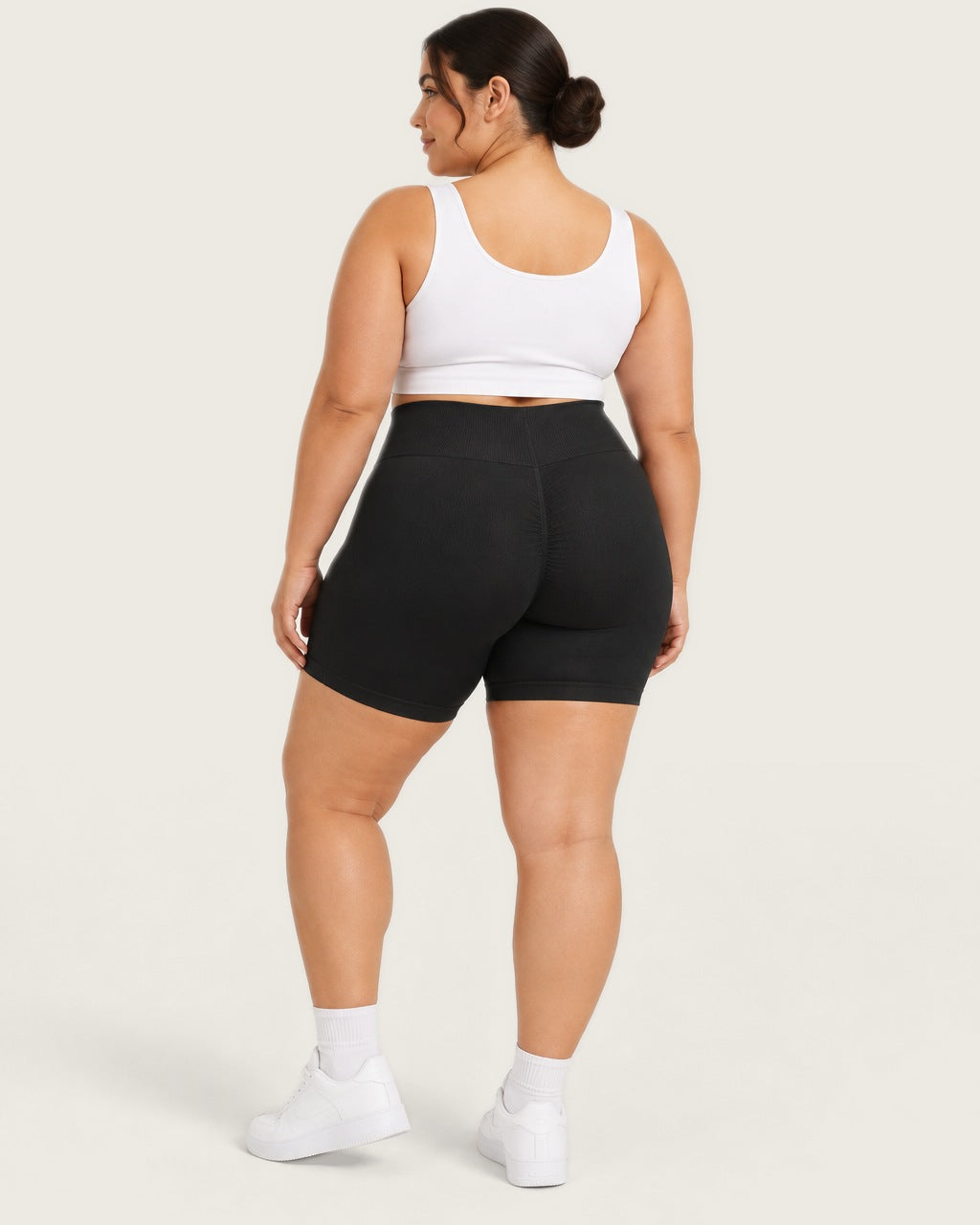 ROMY Sculpt Plus Ruched Shorts in Black — three-quarter back view