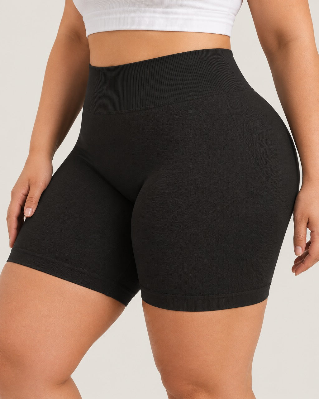 ROMY Sculpt Plus Ruched Shorts in Black — close-up of waistband and fabric