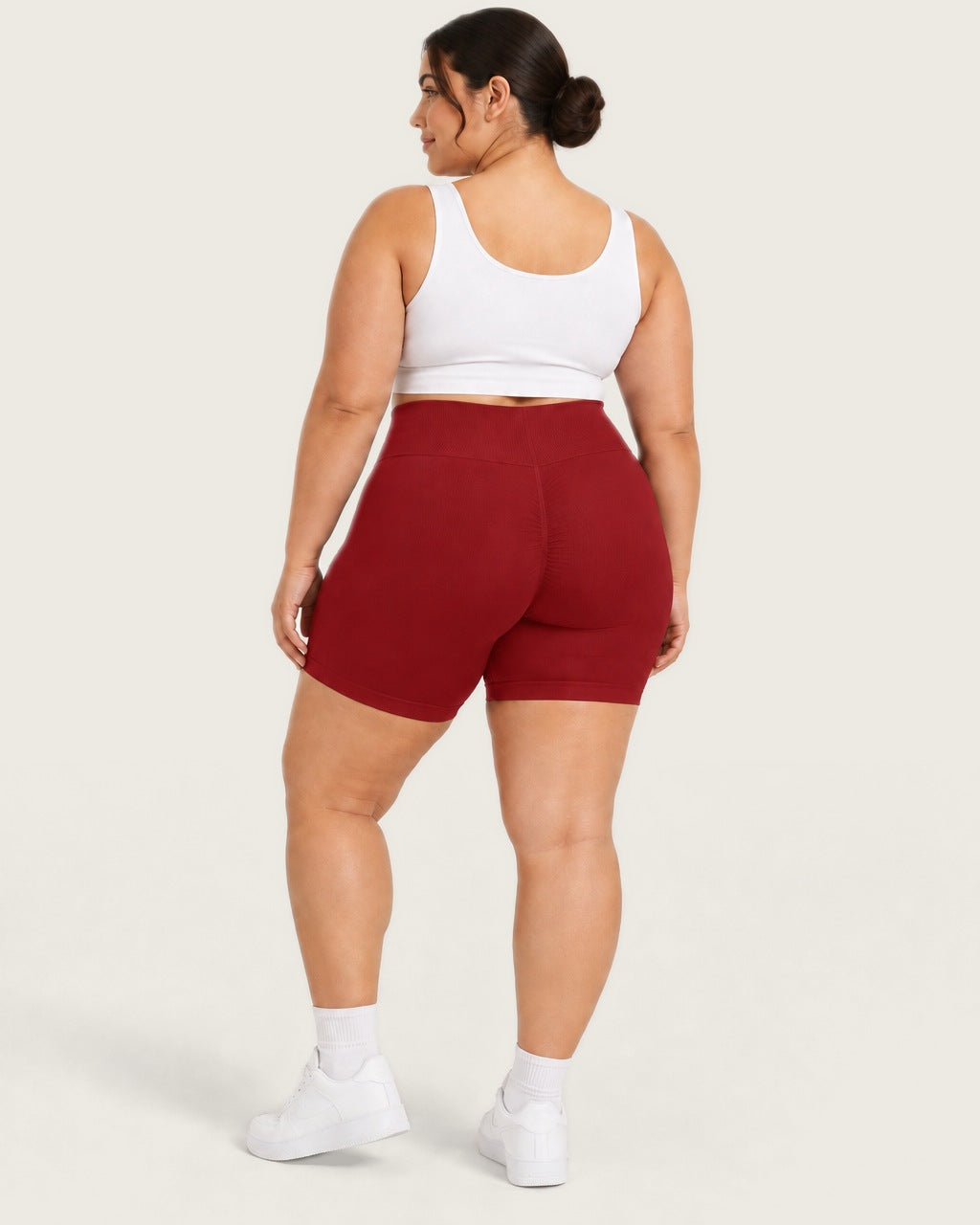 ROMY Sculpt Plus Ruched Shorts in Crimson — three-quarter back view