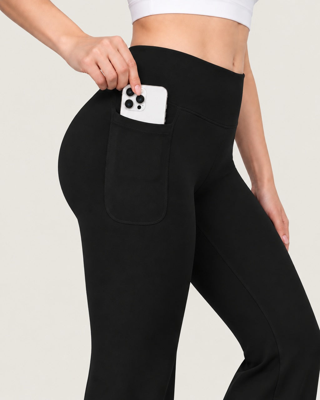 ROMY Sculpt Pocket Flare Pant in Black — close-up of waistband and fabric
