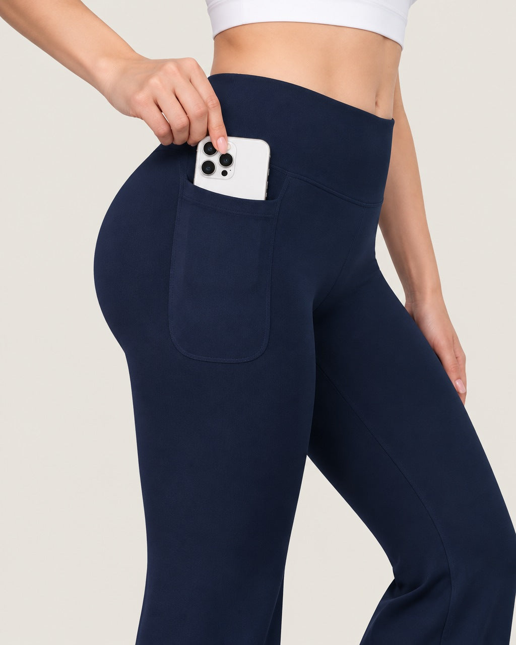 ROMY Sculpt Pocket Flare Pant in Navy — close-up of waistband and fabric