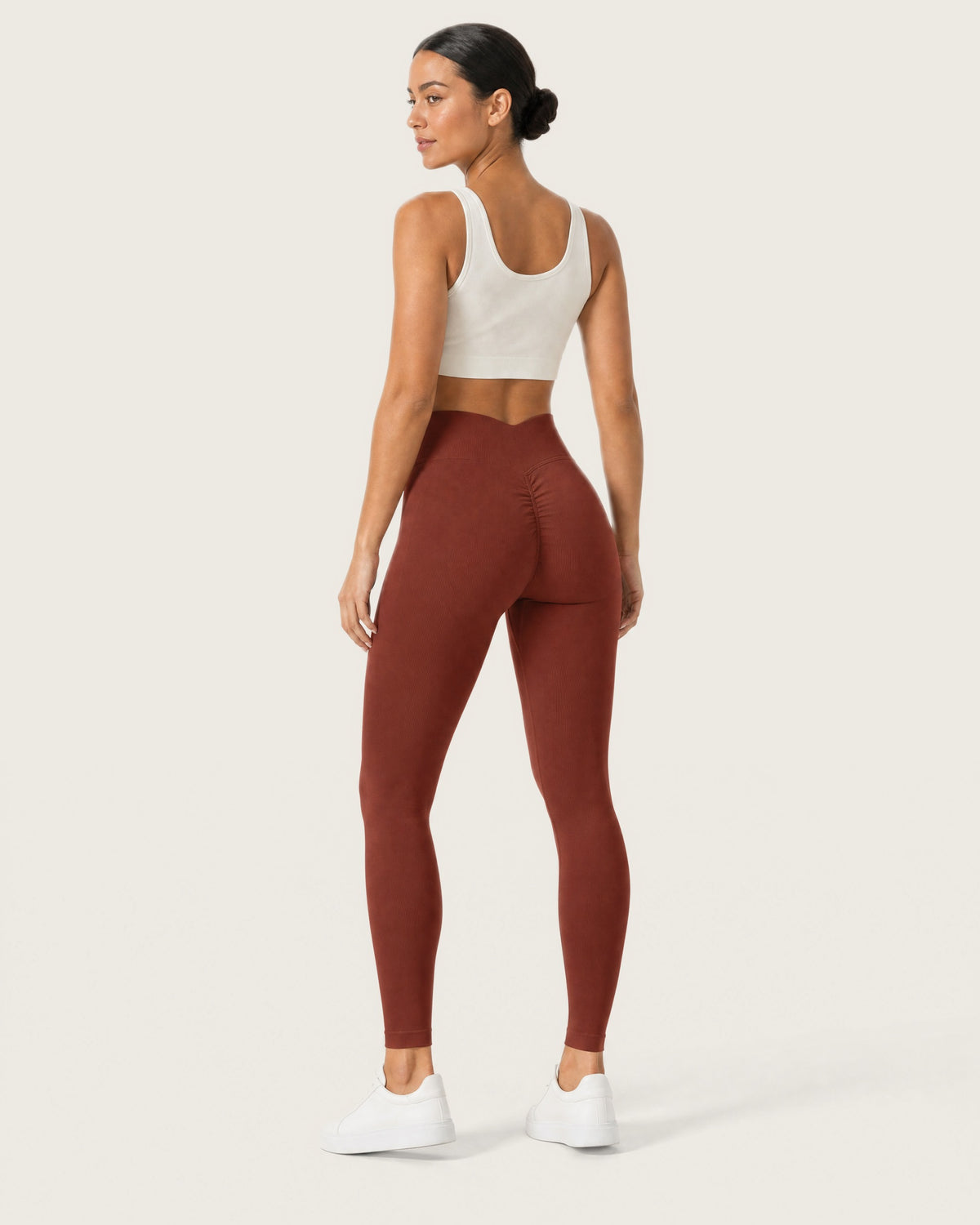 ROMY Sculpt Seamless Legging in Rust — three-quarter back view