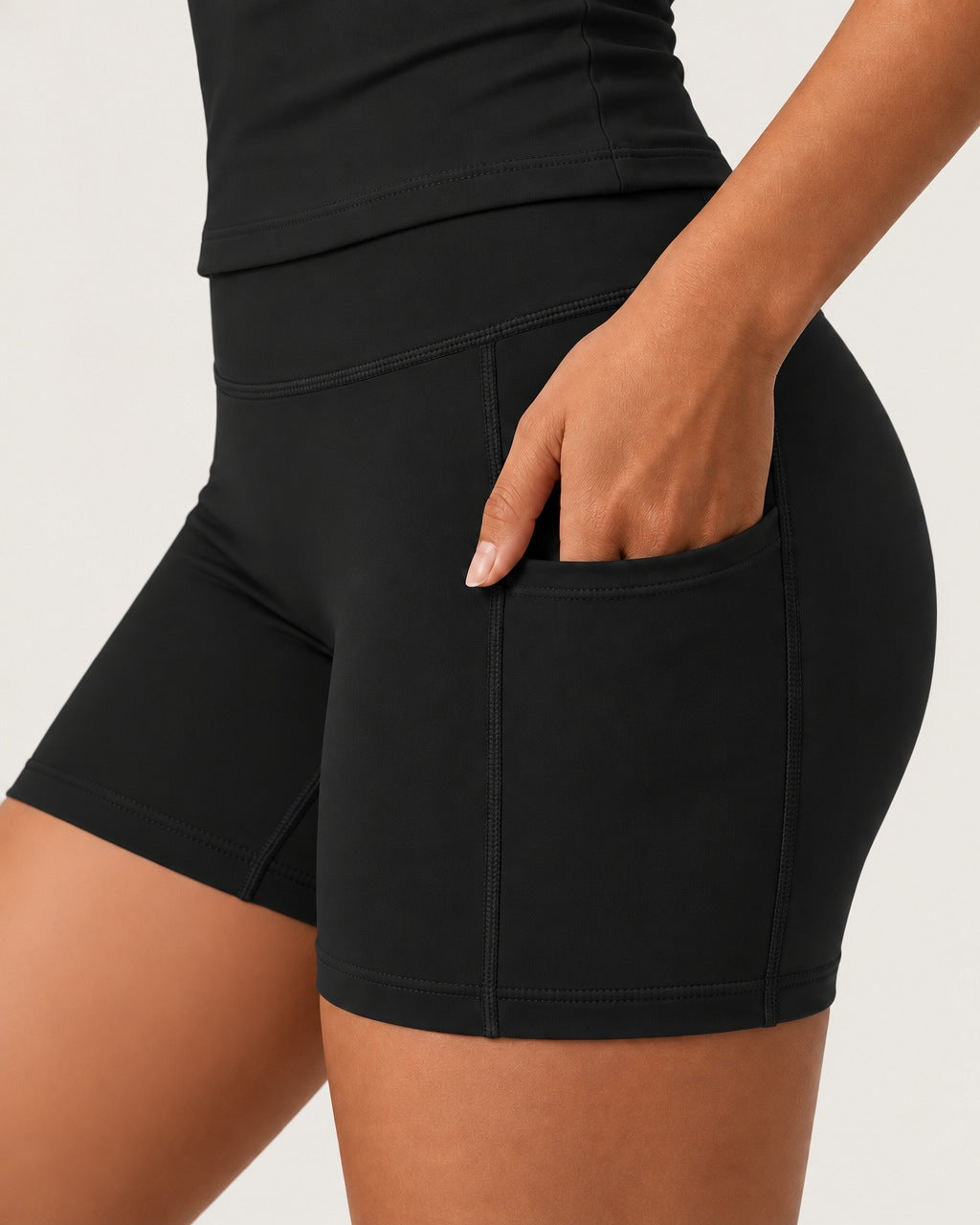ROMY Studio Pocket Short Set in Black — close-up of waistband and fabric
