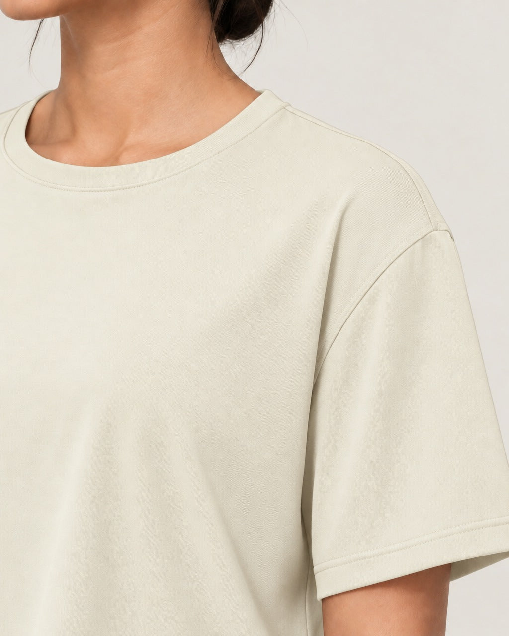 ROMY Ease Cropped Tee in Cream — close-up detail