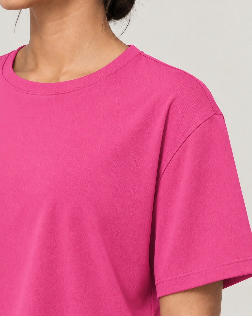 ROMY Ease Cropped Tee in Fuchsia — close-up detail