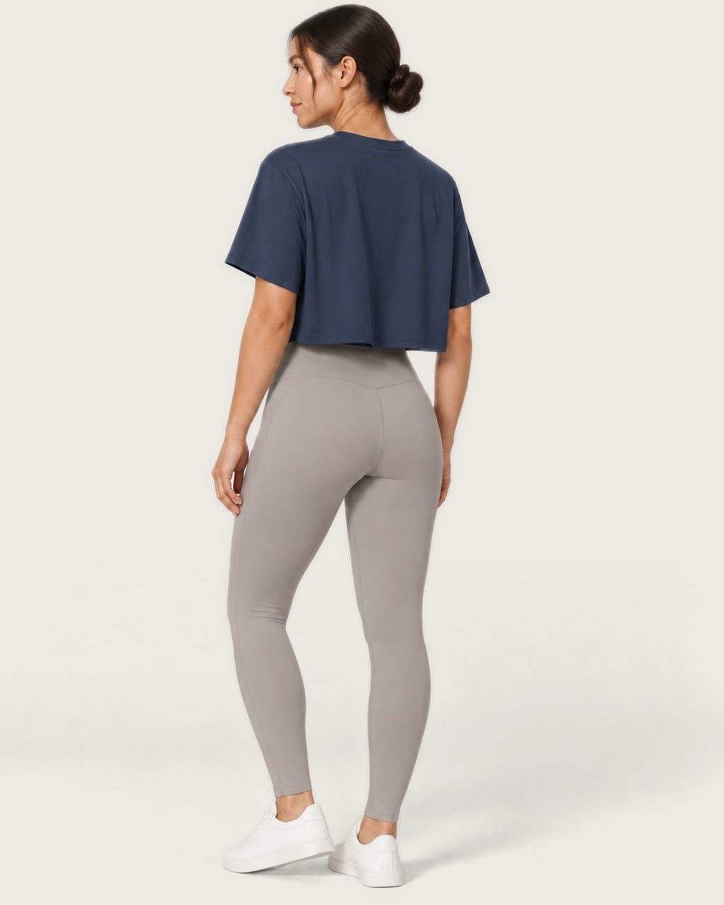 ROMY Ease Cropped Tee in Navy — three-quarter back view