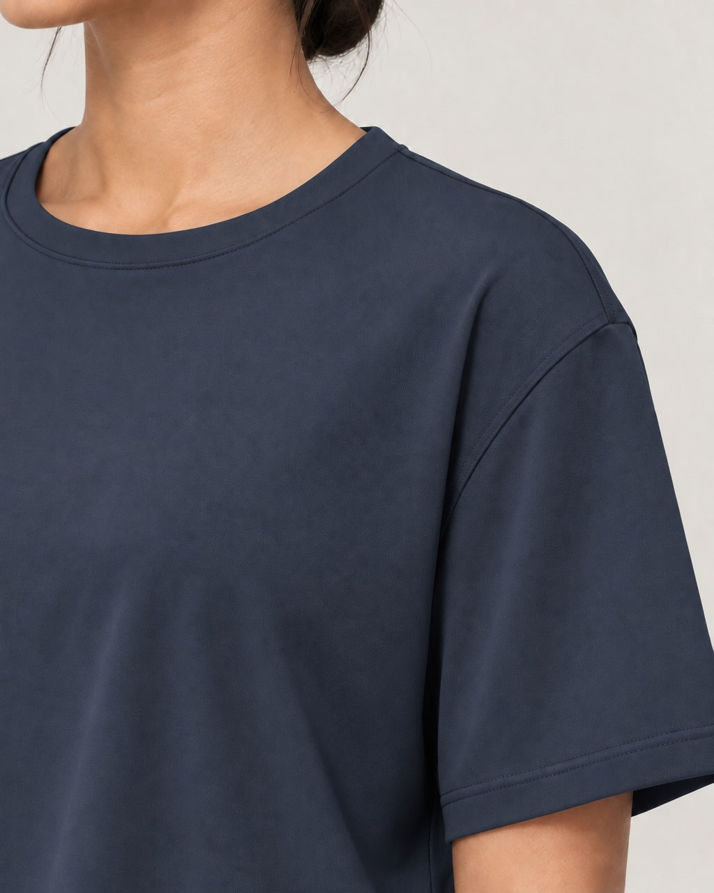 ROMY Ease Cropped Tee in Navy — close-up detail