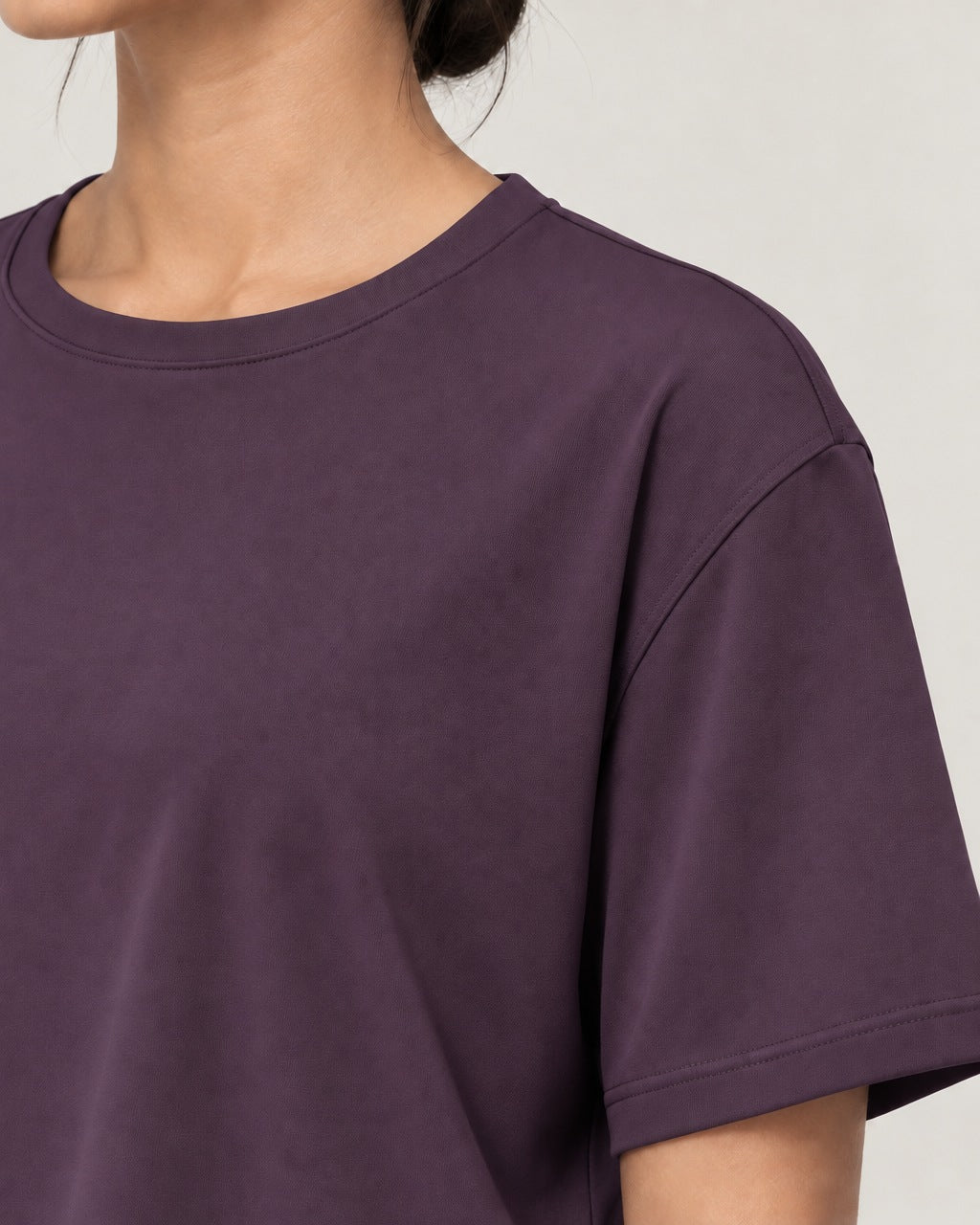 ROMY Ease Cropped Tee in Plum — close-up detail