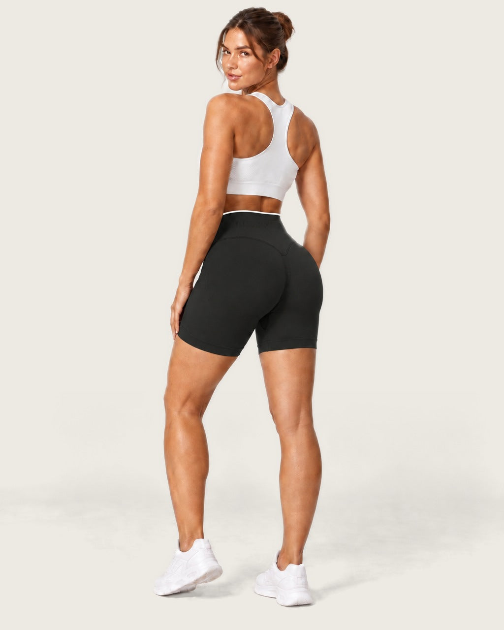 ROMY Form Contrast Waist Shorts in Black — three-quarter back view