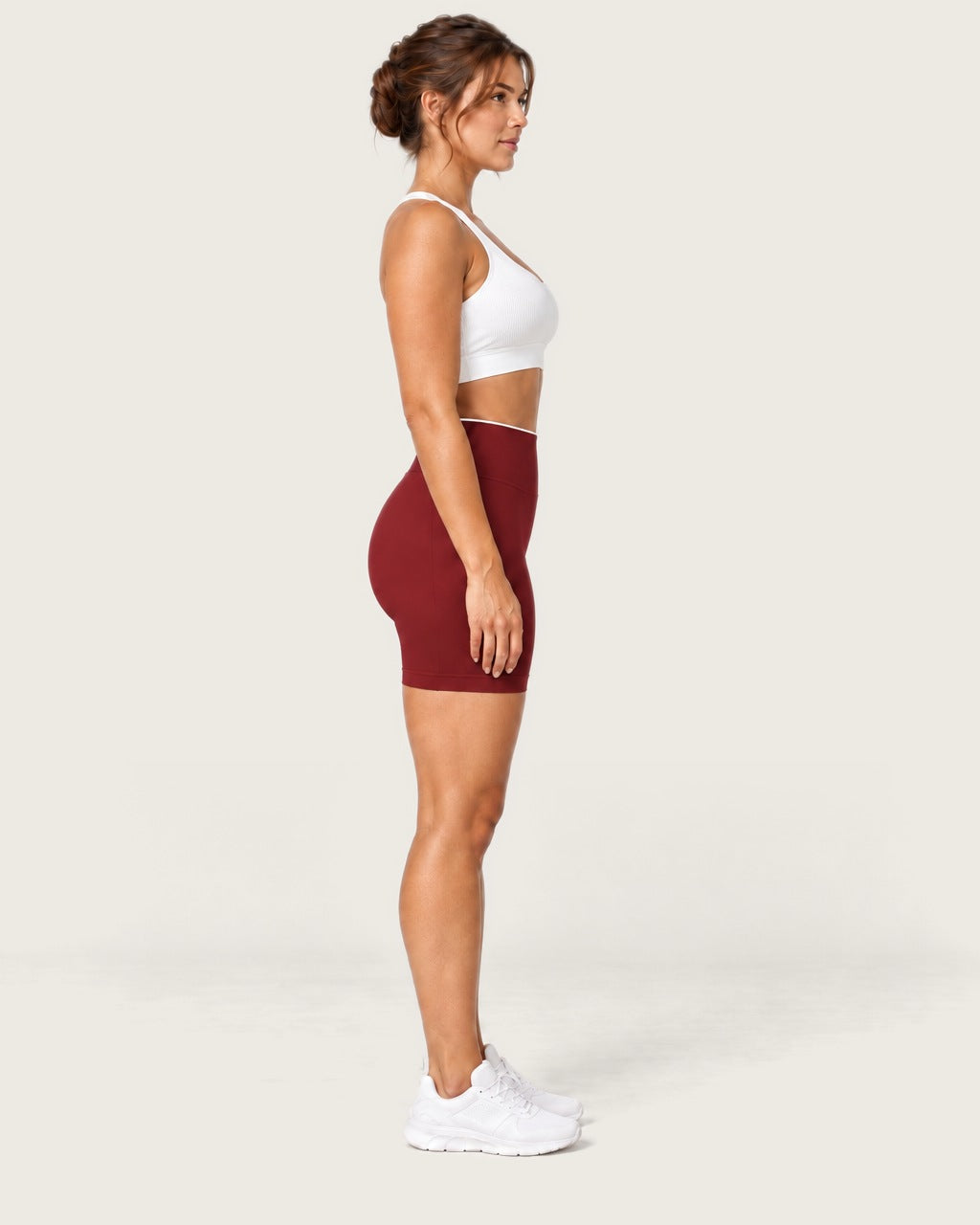 ROMY Form Contrast Waist Shorts in Wine — side profile