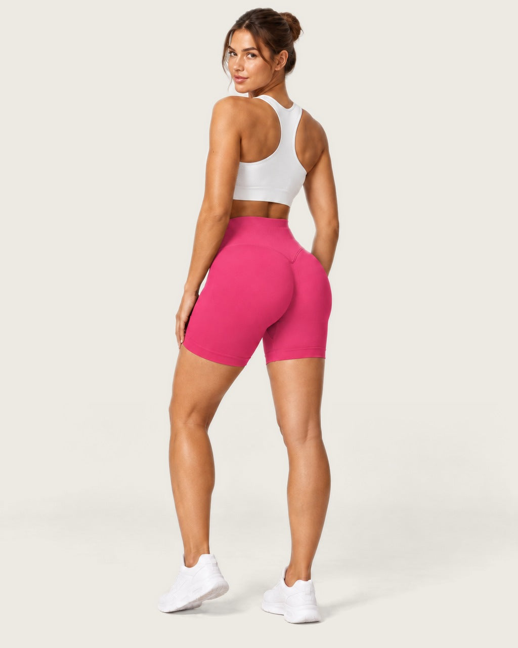 ROMY Form Seamless Shorts in Fuchsia — three-quarter back view