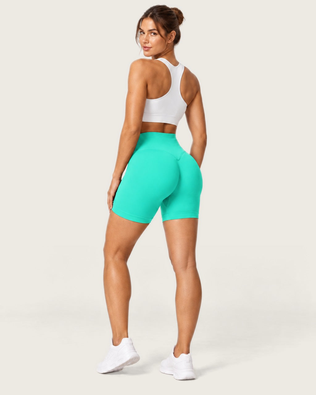 ROMY Form Seamless Shorts in Mint — three-quarter back view