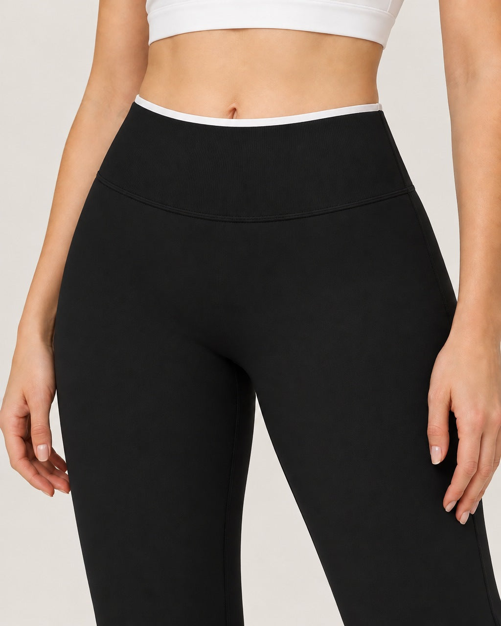 ROMY Sculpt Contrast Waist Flare Pant in Black — close-up of waistband and fabric