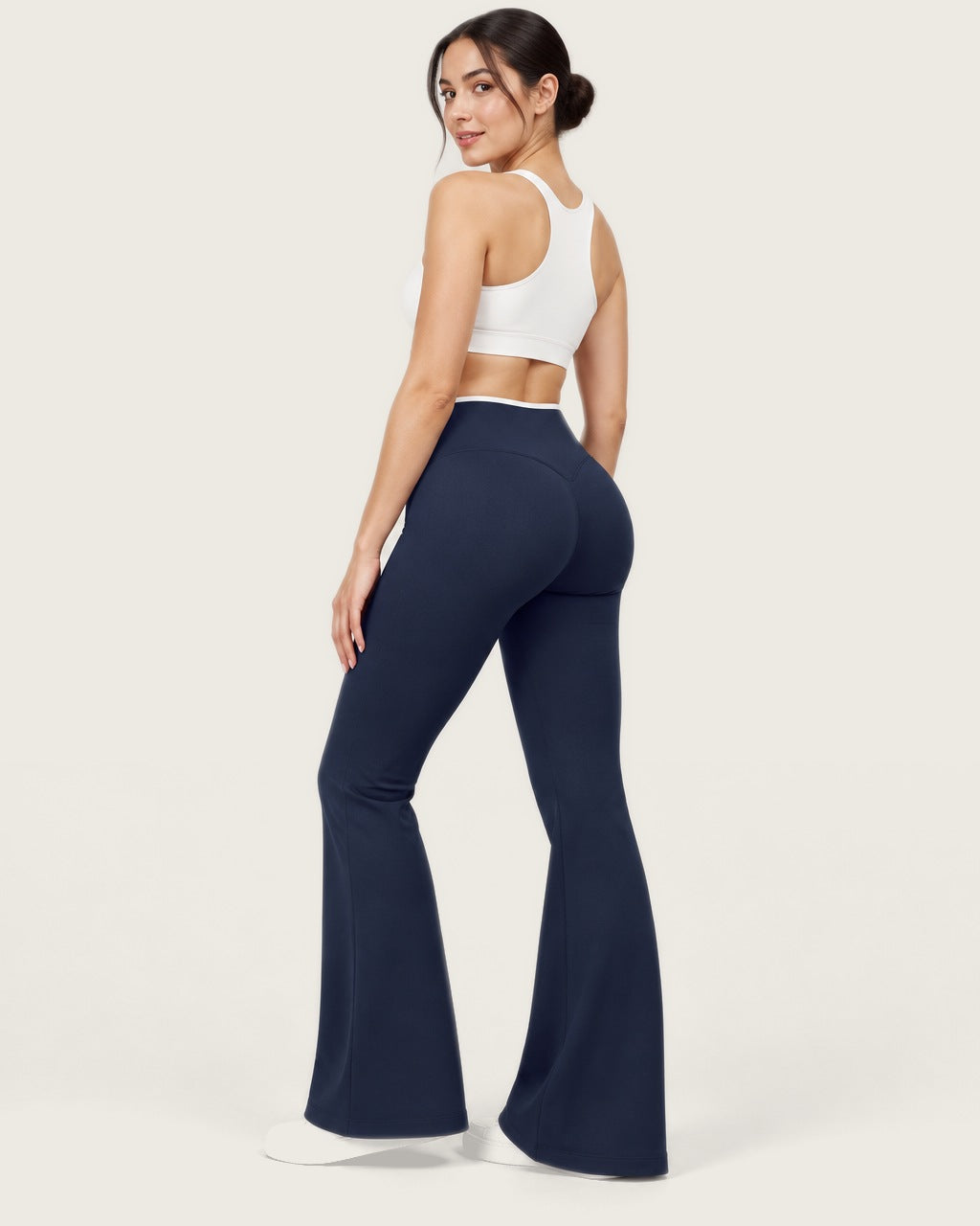 ROMY Sculpt Contrast Waist Flare Pant in Navy — three-quarter back view