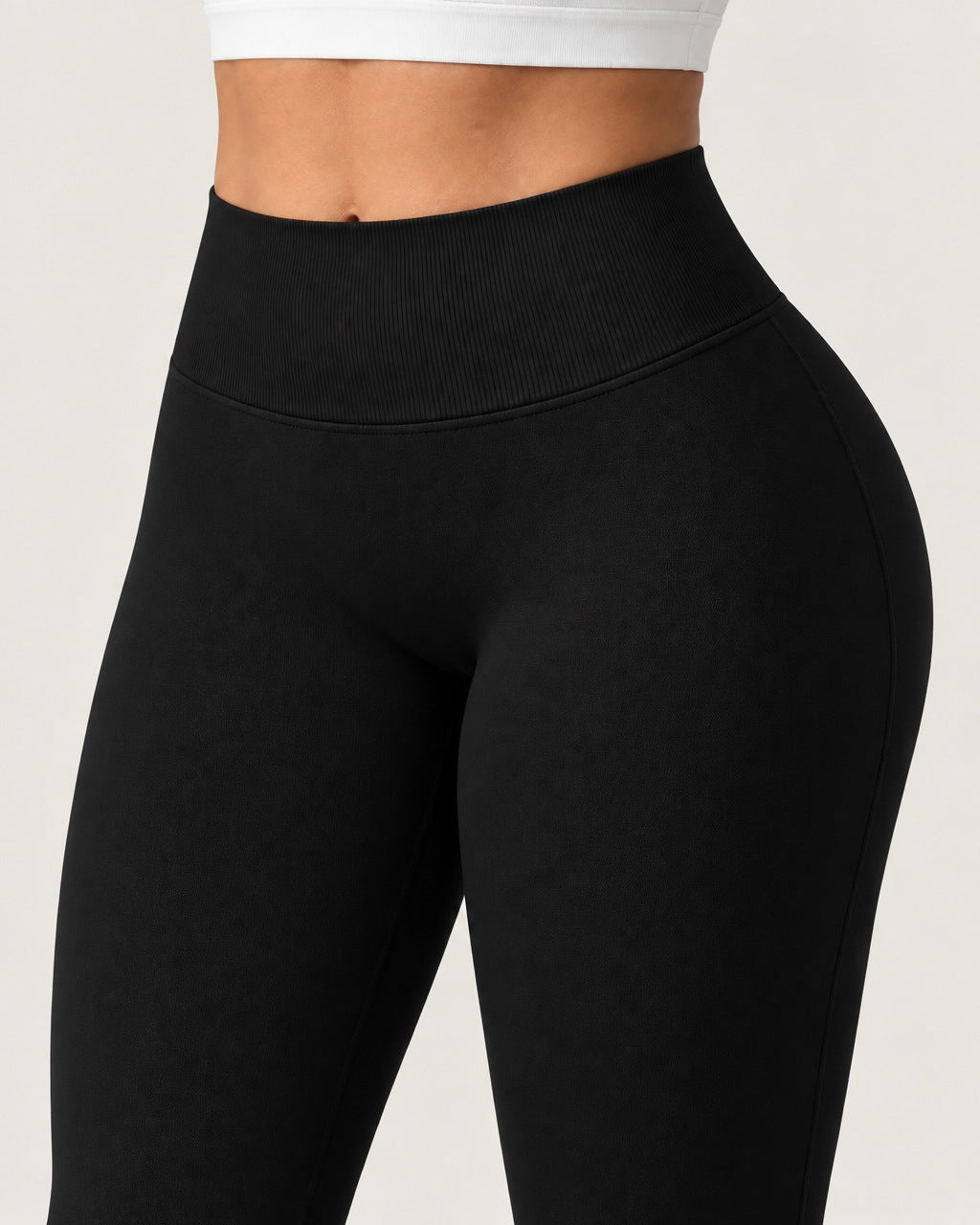 ROMY Sculpt Flare Pant in Black — close-up of waistband and fabric