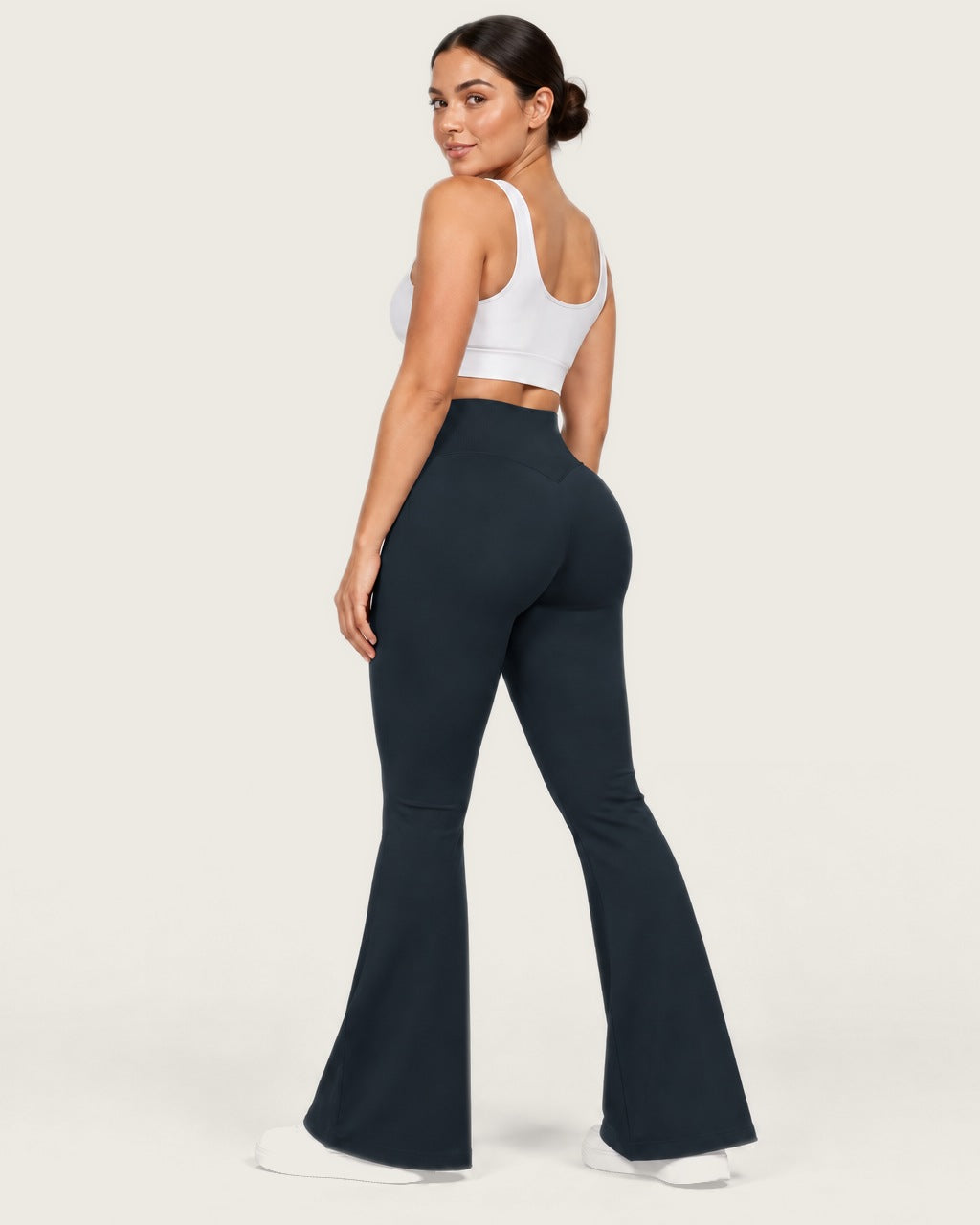 ROMY Sculpt Flare Pant in Midnight — three-quarter back view