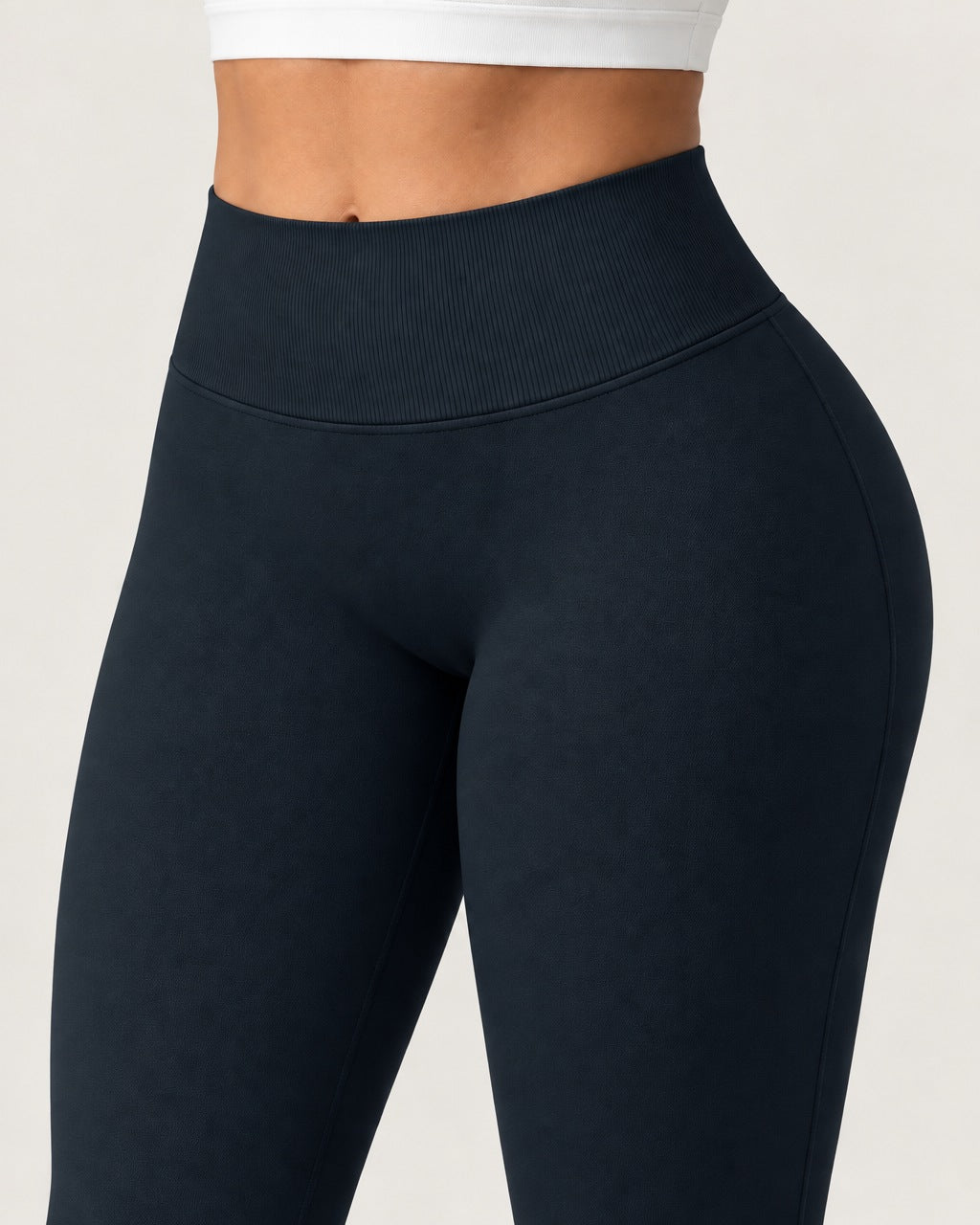 ROMY Sculpt Flare Pant in Midnight — close-up of waistband and fabric