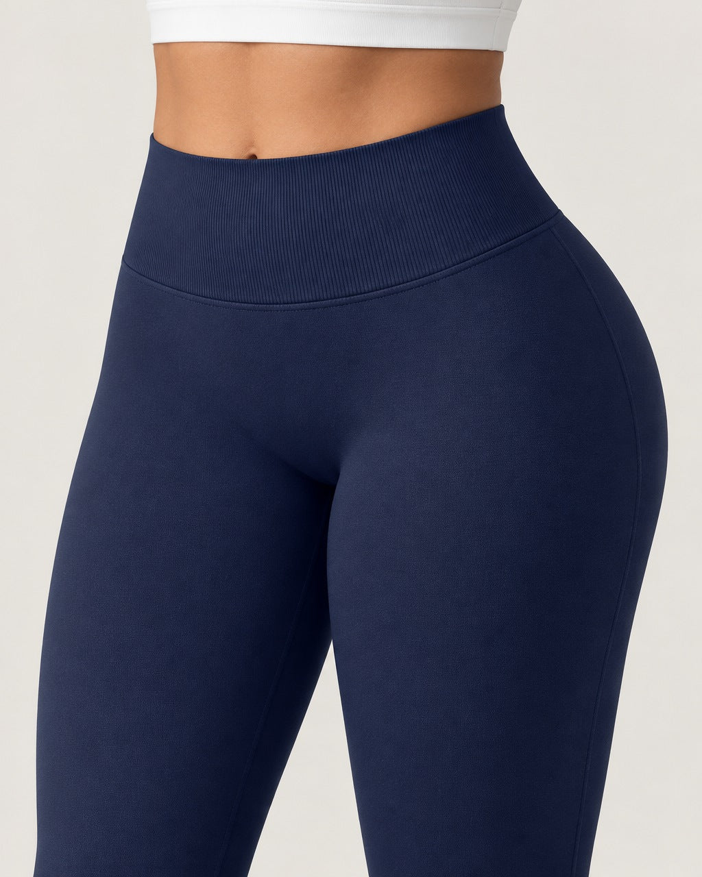 ROMY Sculpt Flare Pant in Navy — close-up of waistband and fabric