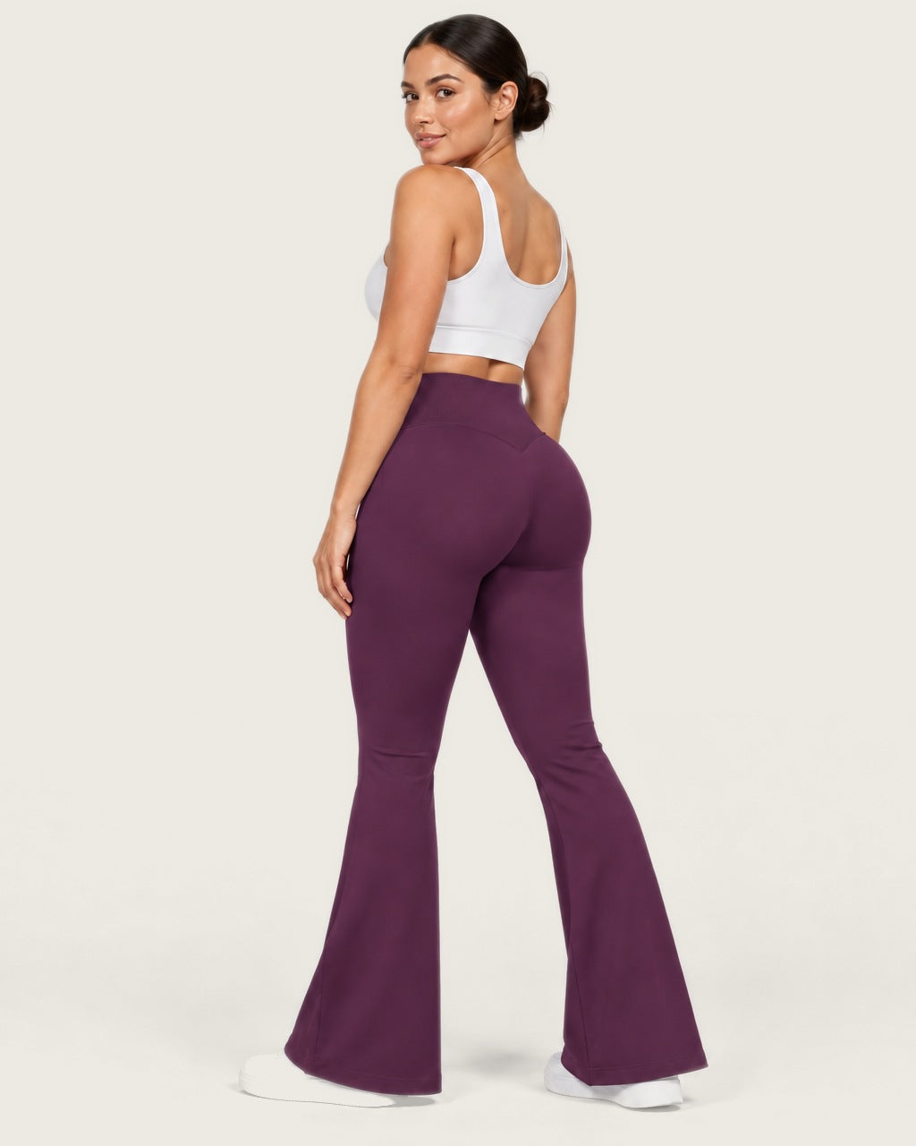 ROMY Sculpt Flare Pant in Plum — three-quarter back view