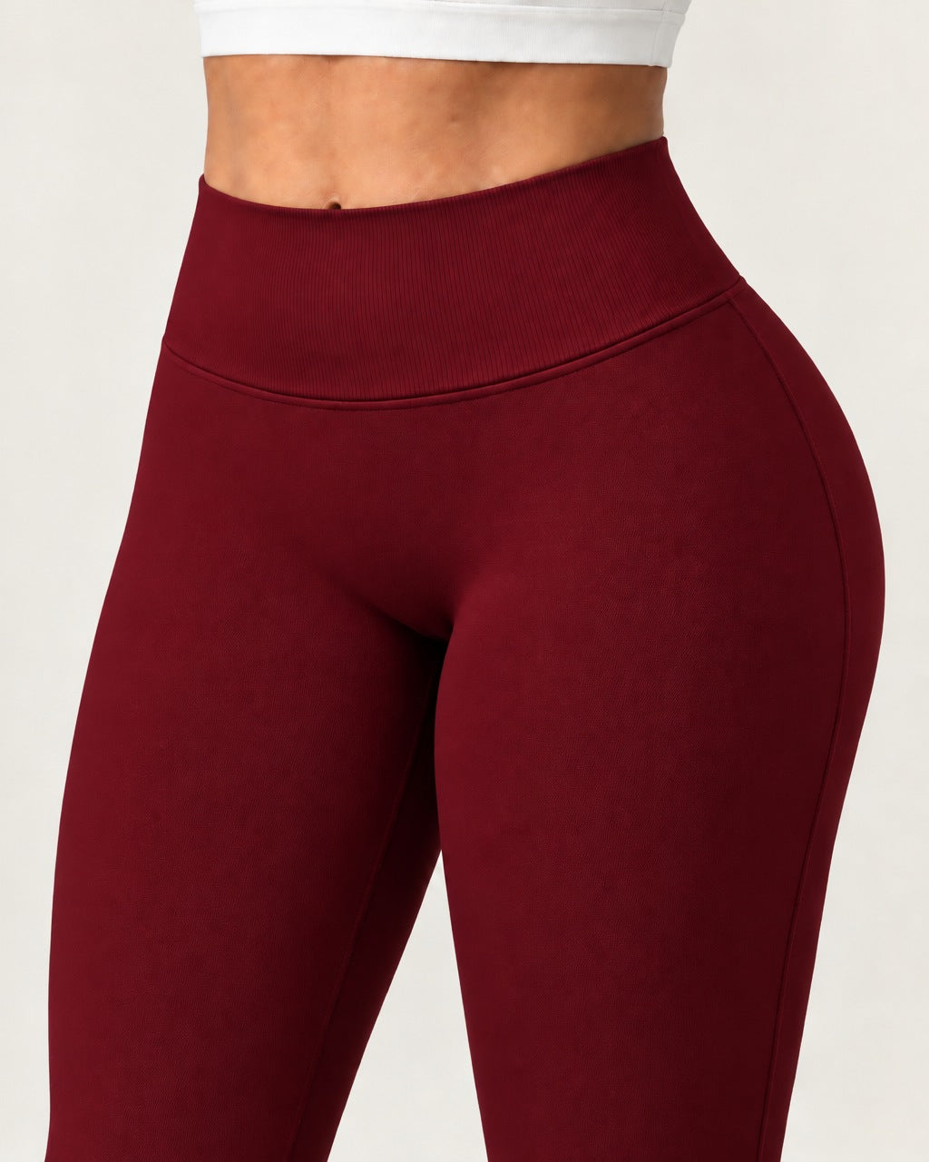 ROMY Sculpt Flare Pant in Wine — close-up of waistband and fabric