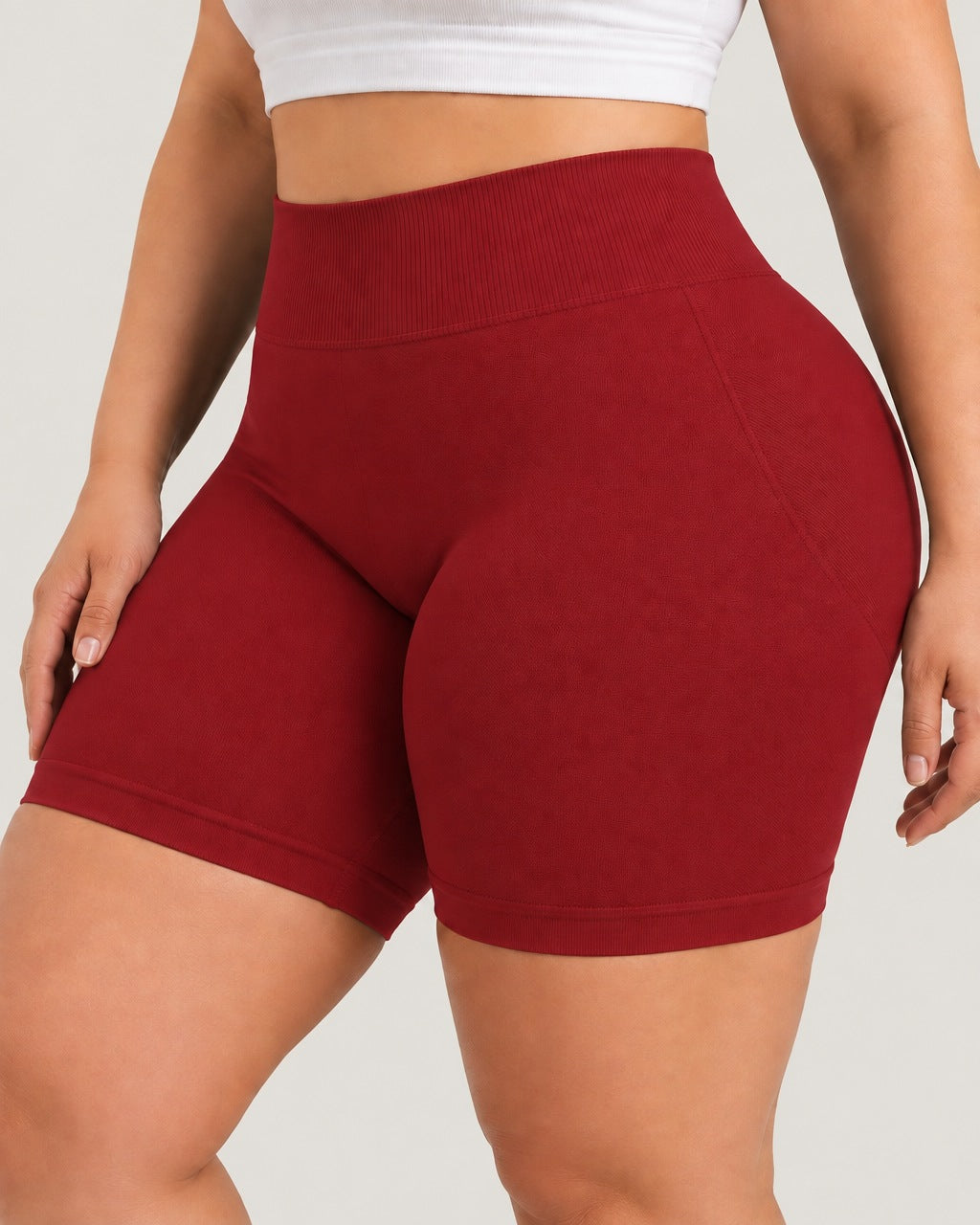 ROMY Sculpt Plus Ruched Shorts in Crimson — close-up of waistband and fabric