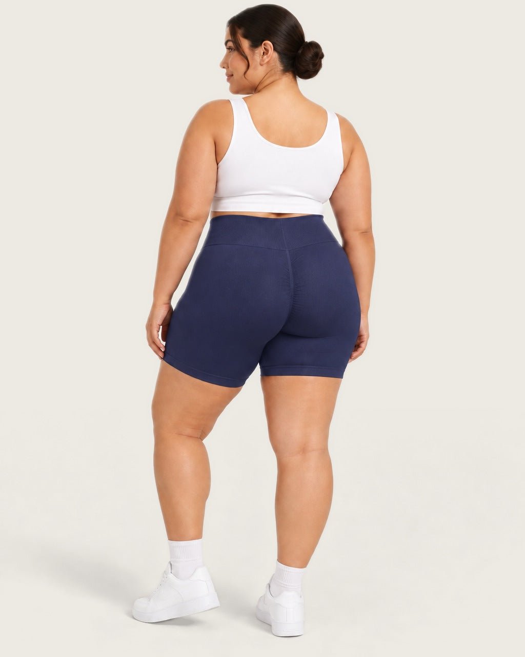 ROMY Sculpt Plus Ruched Shorts in Navy — three-quarter back view
